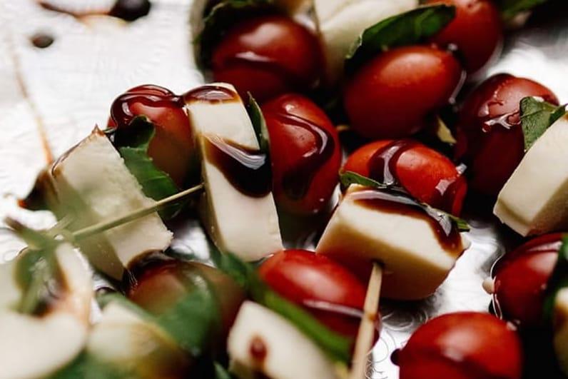 Skewers of cheese and tomatoes on a plate